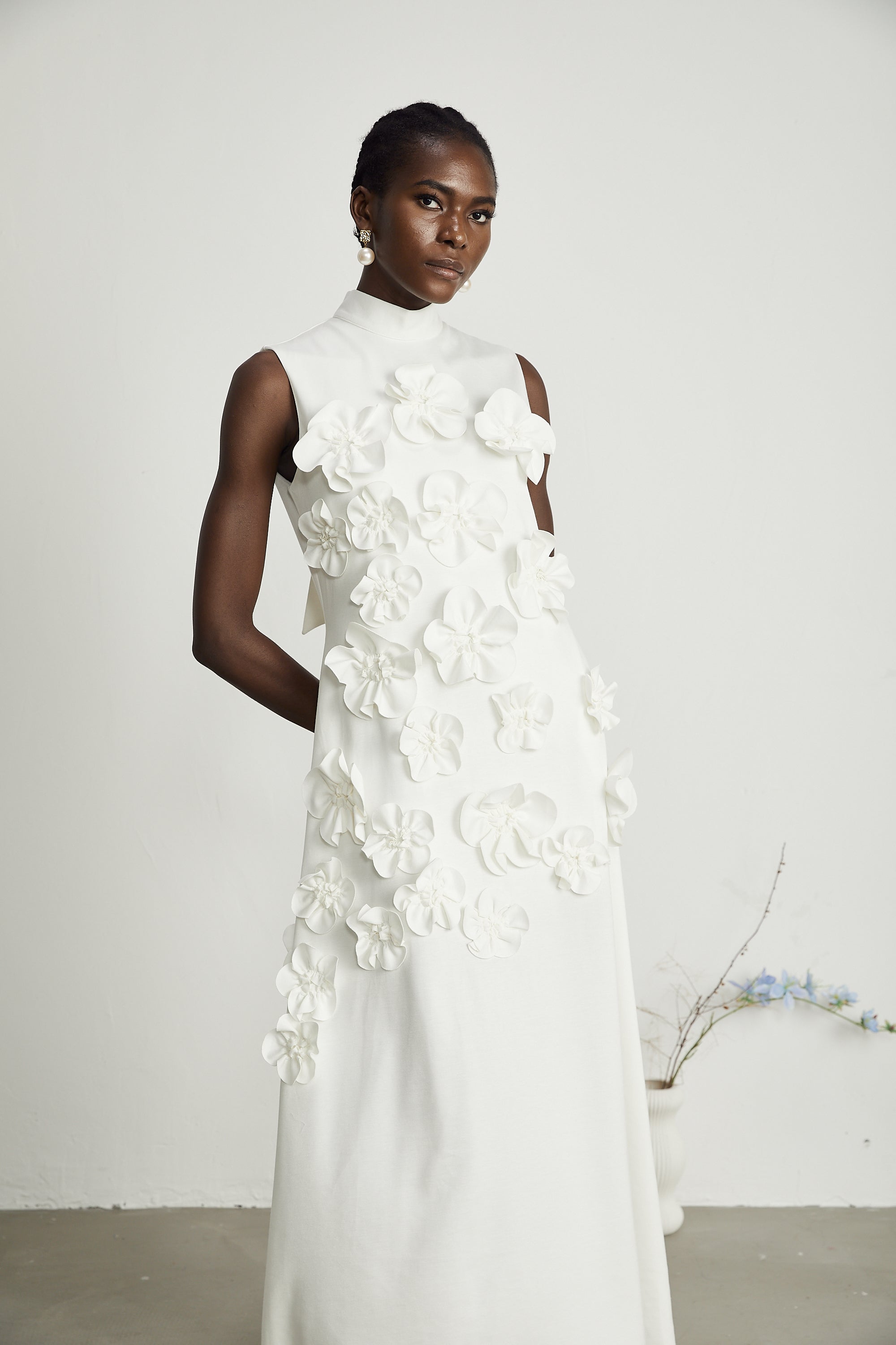 Magali White Sleeveless Maxi Dress with Faux Flower & Bow-Tie Embellishment