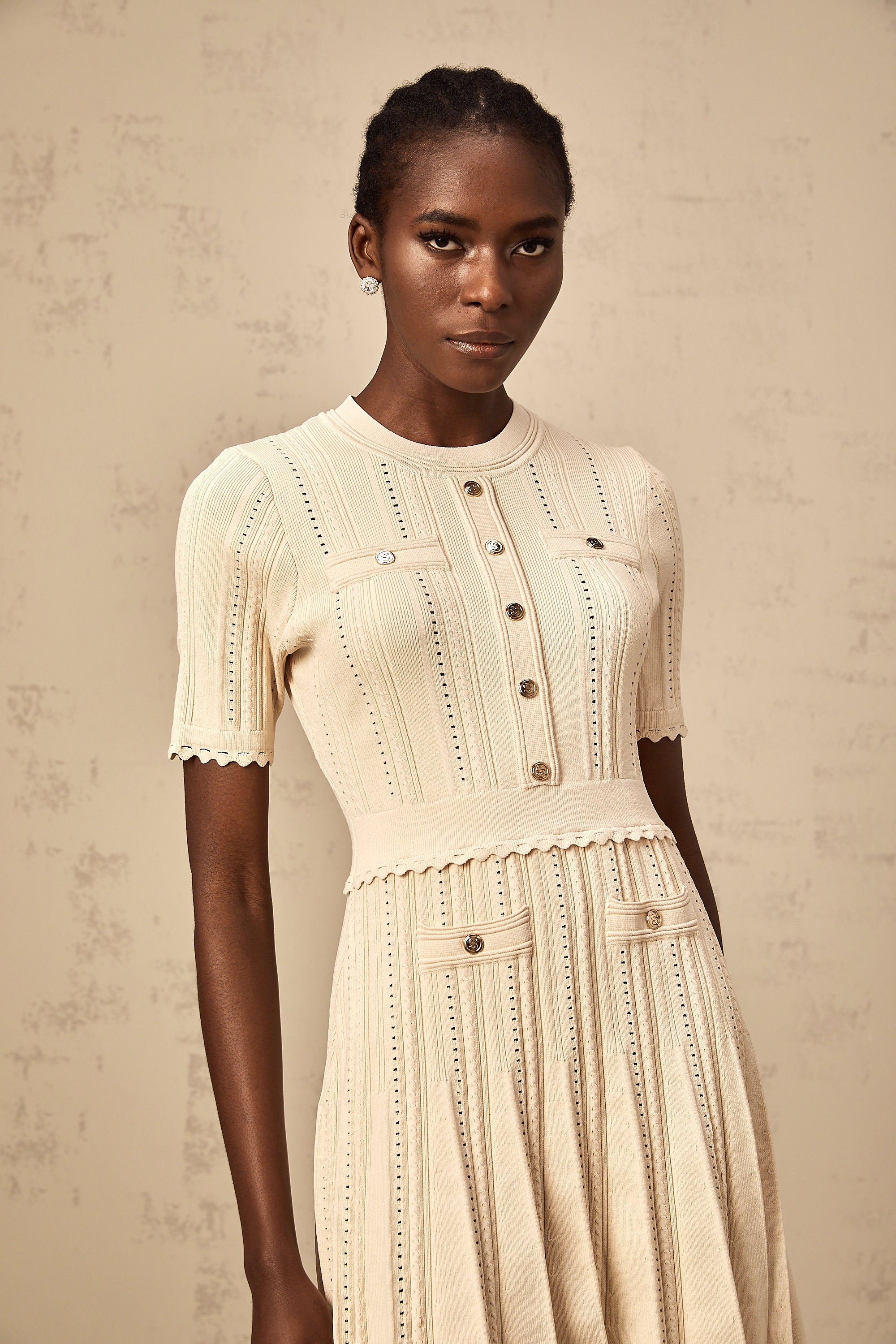Amélie neutrals pointelle-trim pleated knit mini dress