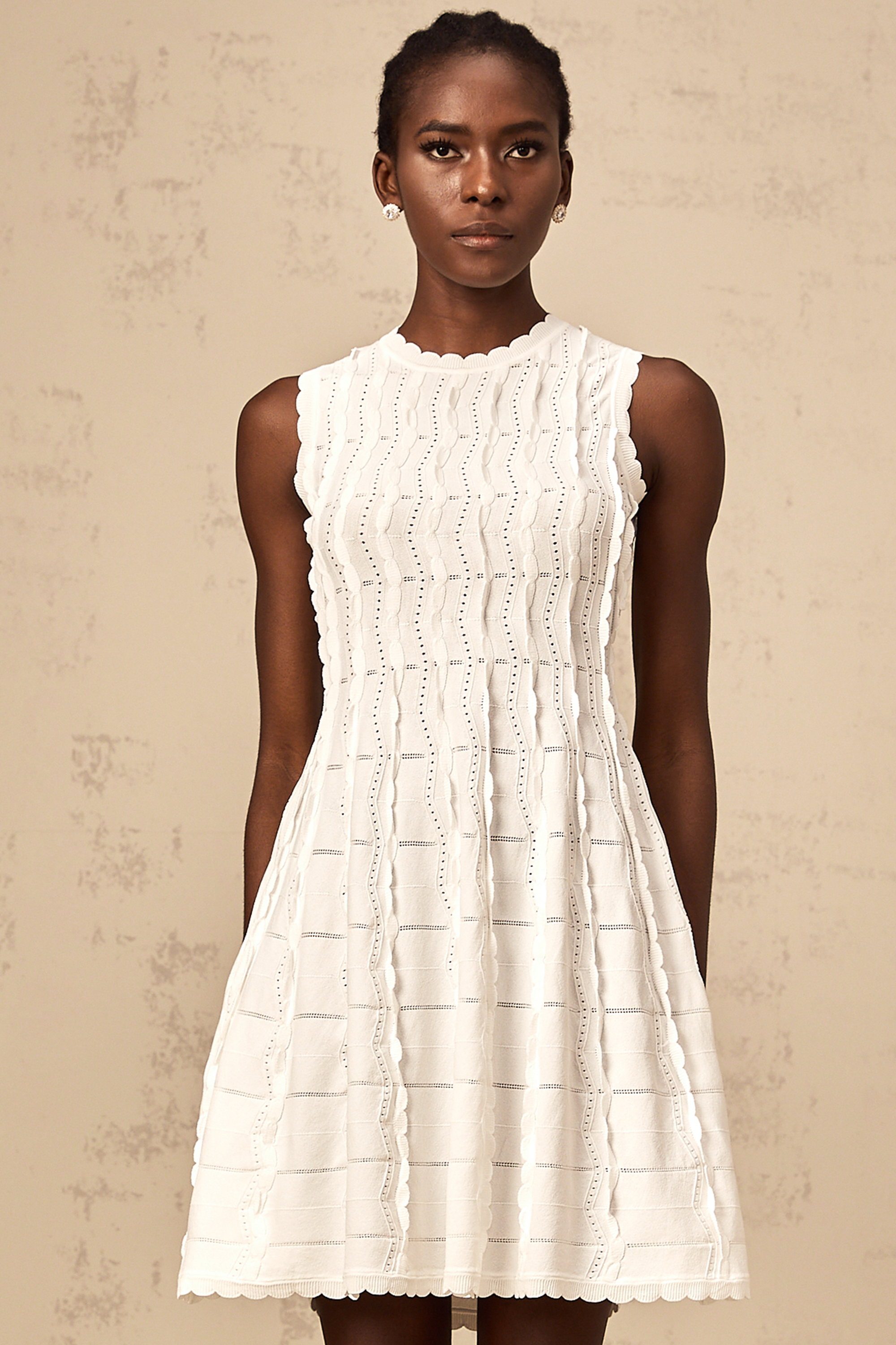 Esmée white ruffled sleeveless knit mini dress